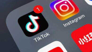 Close-up of TikTok app icon with a notification badge on a smartphone screen.