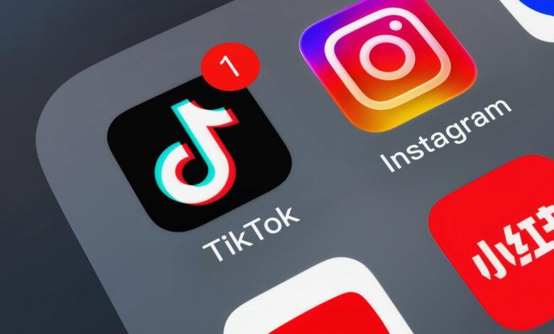 Close-up of TikTok app icon with a notification badge on a smartphone screen.