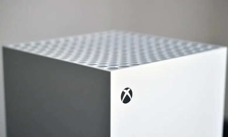 Close-up of a white Xbox Series S console with the Xbox logo.