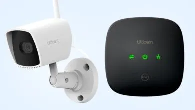 Ulticam security camera and base station on a light blue background.