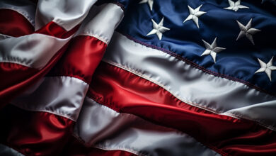 Close-up of a draped American flag with red, white, and blue colors.