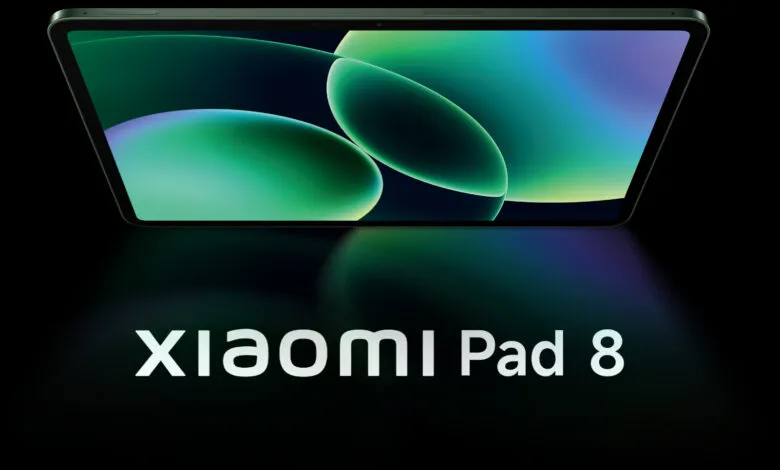 Xiaomi Pad 8 tablet with a green and blue abstract wallpaper on a black background.