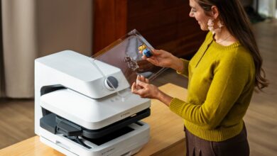 Woman using xTool WonderPress to transfer design onto a small plush toy.