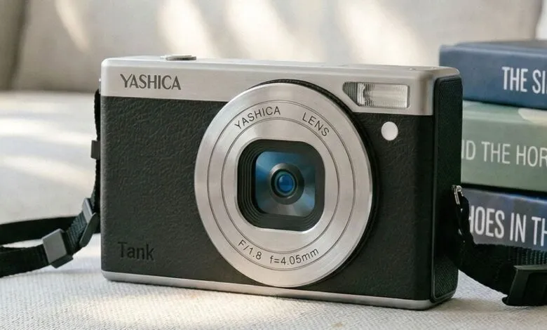 Yashica Tank camera with a silver and black design, strap, and lens.