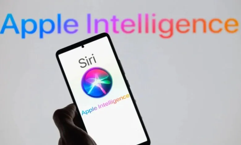 Hand holding smartphone displaying Siri and Apple Intelligence logos.