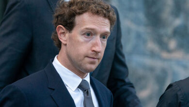 Mark Zuckerberg in suit, looking slightly downcast.