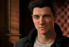 Close-up of James Bond character with dark hair and blue eyes, slight smirk.