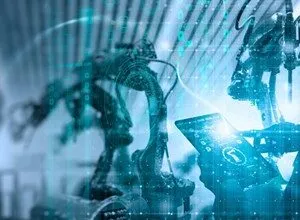 Robotic arms and a hand holding a tablet, representing automation and technology.