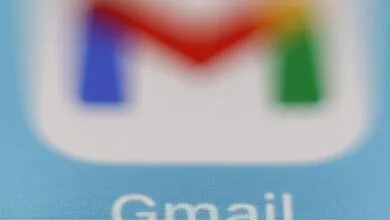Close-up of the Gmail logo with blurred, vibrant colors.