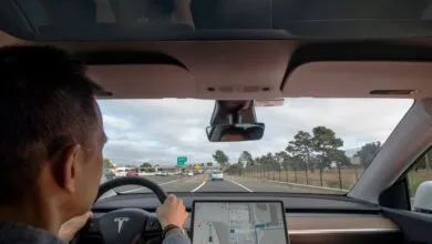 Driver's perspective from inside a Tesla on the highway.