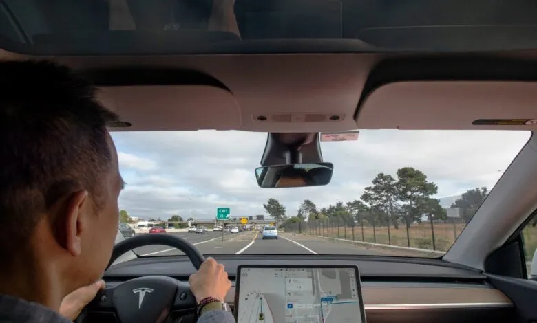 Driver's perspective from inside a Tesla on the highway.