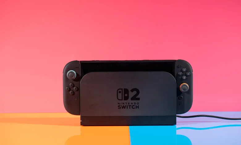 Nintendo Switch 2 console docked on a colorful surface.