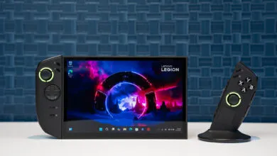 Lenovo Legion Go handheld gaming PC with detachable controller on white surface.