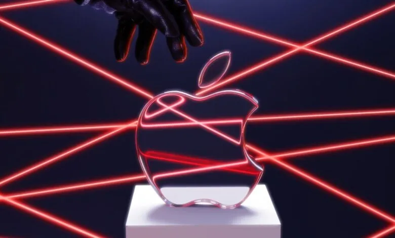 Apple logo on pedestal with red laser beams and gloved hand above.