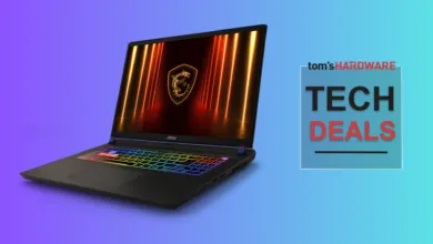 MSI gaming laptop with rainbow keyboard and dragon logo on screen.