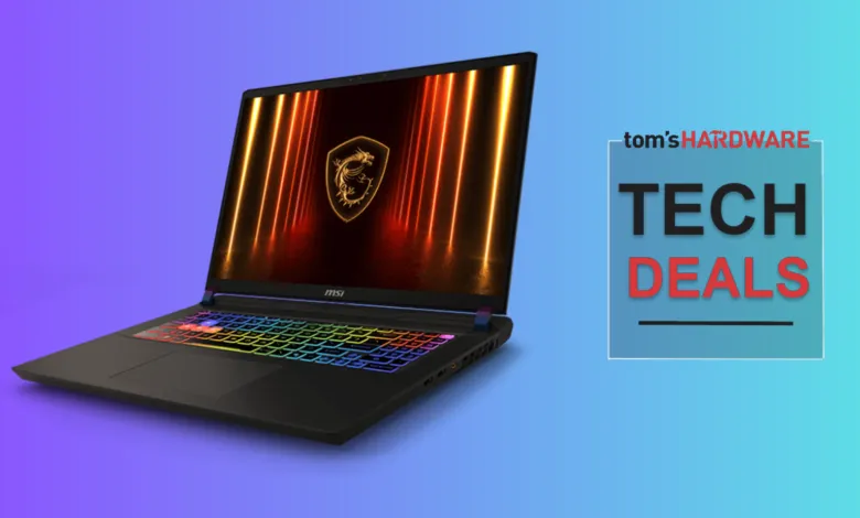 MSI gaming laptop with rainbow keyboard and dragon logo on screen.