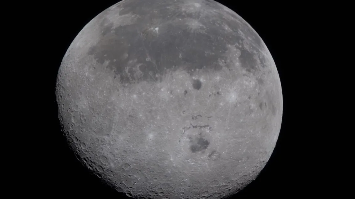 Detailed view of the moon's surface, showing craters and lunar maria.