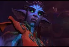 Close-up of a purple-skinned character with glowing green eyes and prominent tusks.