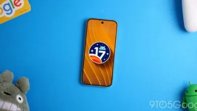 Android 17 logo on a smartphone screen against a blue background.