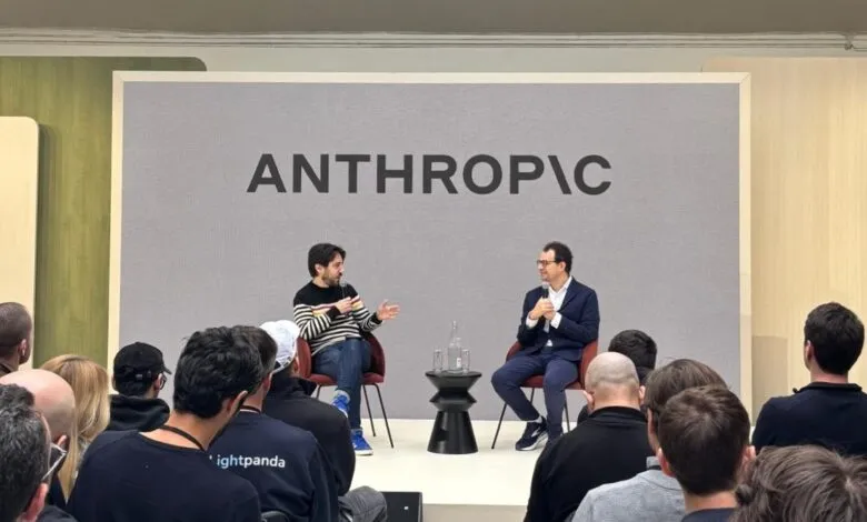 Dario Amodei of Anthropic speaks at event with audience.