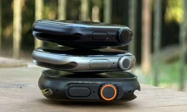 Three Apple Watches stacked on top of each other, showing different models.