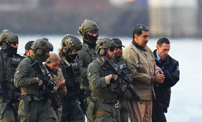 Nicolás Maduro escorted by armed officers in tactical gear.