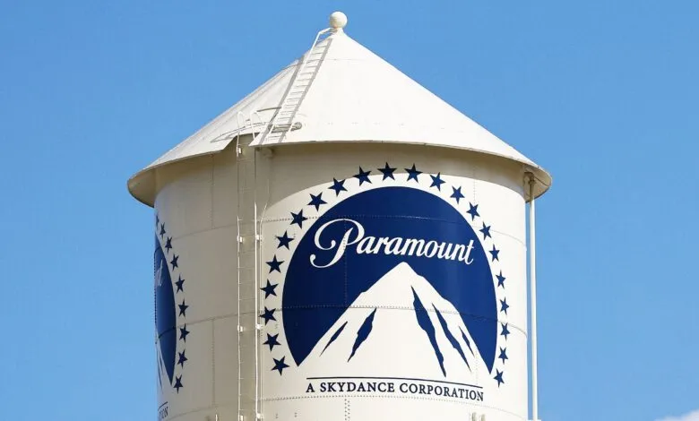Paramount water tower with logo against a clear blue sky.