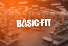 Basic-Fit gym interior with logo and exercise equipment.