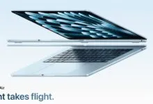 Sleek silver MacBook Air floating against a light blue gradient background.