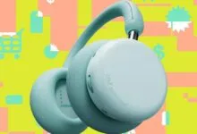 CMF by Nothing headphones in light blue against a colorful shopping-themed background.