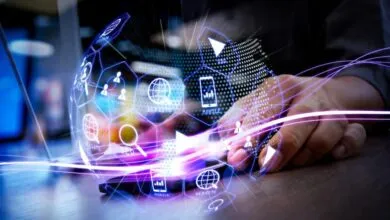 Person using smartphone with digital marketing icons overlayed.