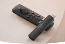 Amazon Fire TV Stick and remote on a light surface.