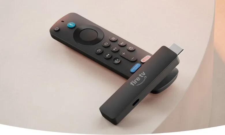 Amazon Fire TV Stick and remote on a light surface.