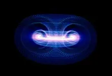 Abstract glowing blue and pink torus shape on black background.