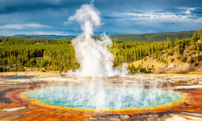 Grand Prismatic Spring in Yellowstone with colorful rings and rising steam.