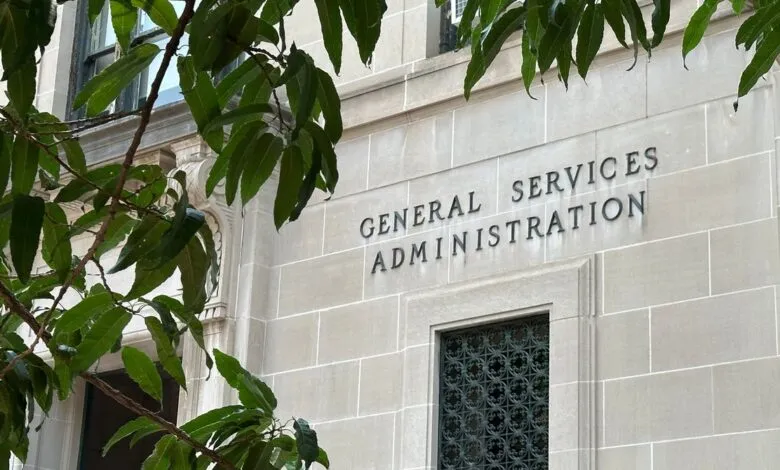 Exterior of the General Services Administration building with foliage.