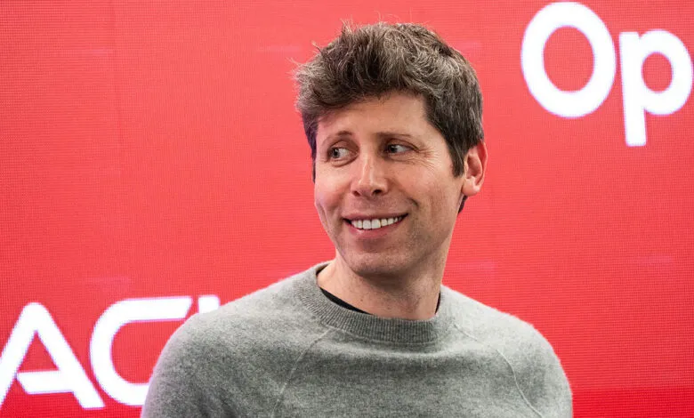 Sam Altman smiles against a red OpenAI backdrop.