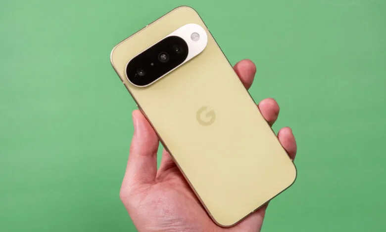 Hand holding a Google Pixel phone with a distinctive camera bar.