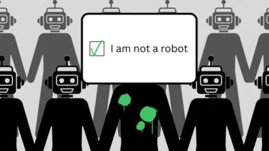"I am not a robot" test with robots holding hands, one with green paint.