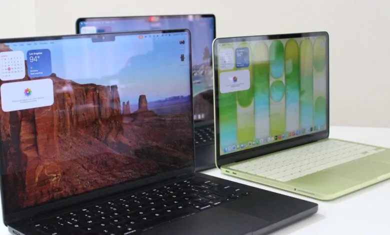 Three Apple MacBooks on a white surface, each with a different screen display.