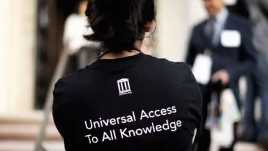 Person wearing Internet Archive shirt with 'Universal Access To All Knowledge'.