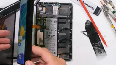 LG rollable phone being disassembled, internal components visible.