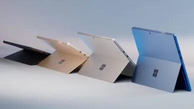 Four Microsoft Surface Pro tablets in black, gold, silver, and blue.