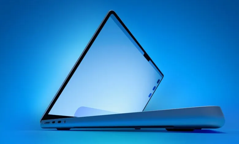Sleek laptop with screen slightly open against a blue gradient background.