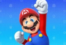 Mario character with fist raised in victory pose on blue background.