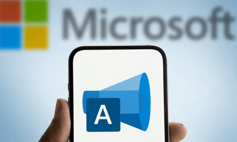 Microsoft Advertising logo displayed on a smartphone screen, held by a hand.