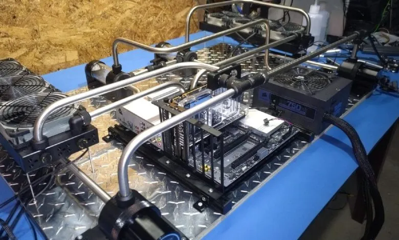 Custom PC build with water cooling system and visible components.