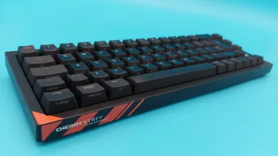 Black Cherry XTRFY K5 Pro TMR Compact keyboard on a blue background.