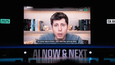 Man speaking at SK AI Summit 2025, with 'AI NOW & NEXT' displayed.