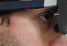 Close-up of person wearing augmented reality glasses.